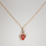 14K yellow gold padparadscha sapphire pendant