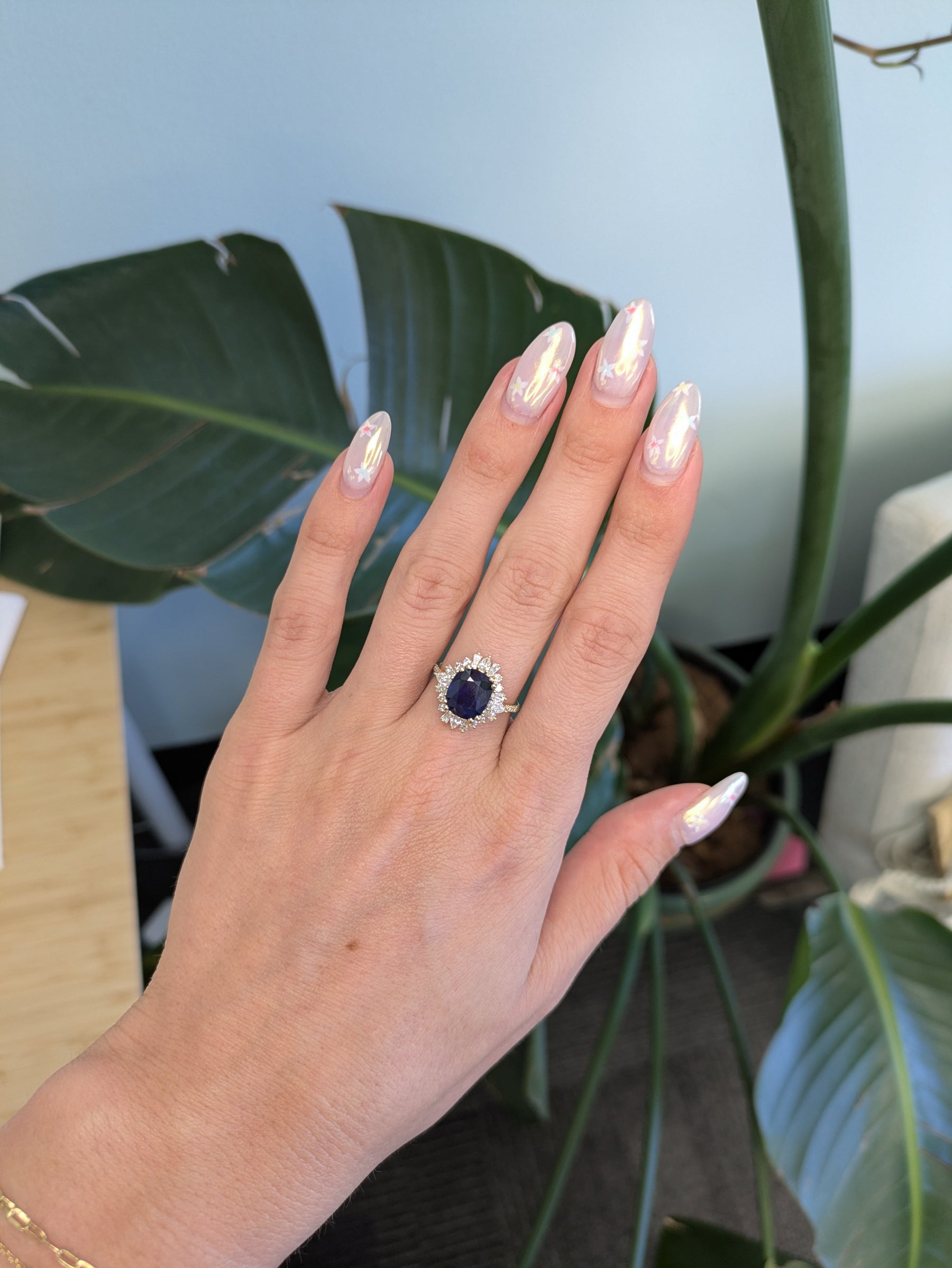 14K yellow gold GIA Ceylon sapphire cushion ring with diamond halo