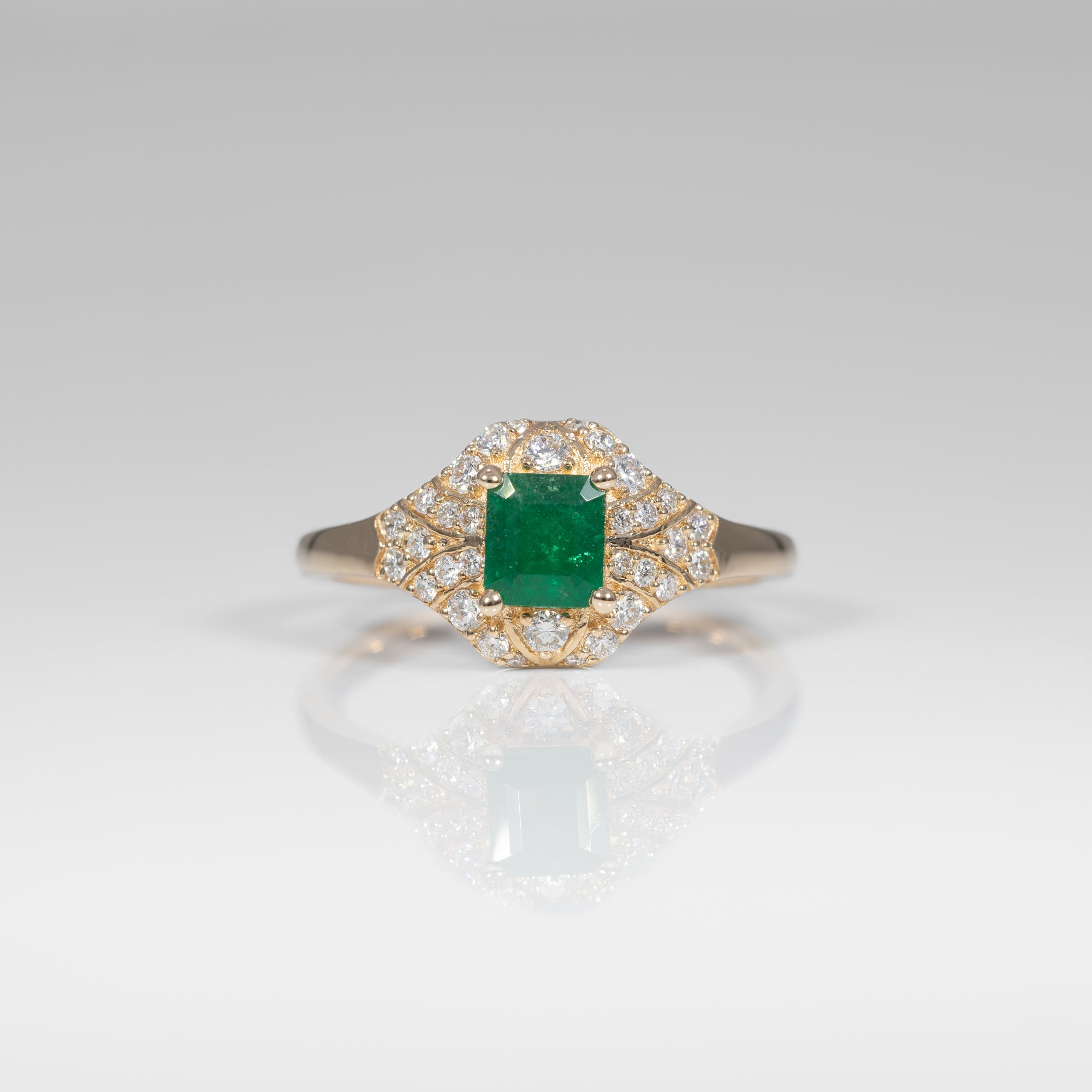 14K yellow gold Colombian emerald ring with diamond accents