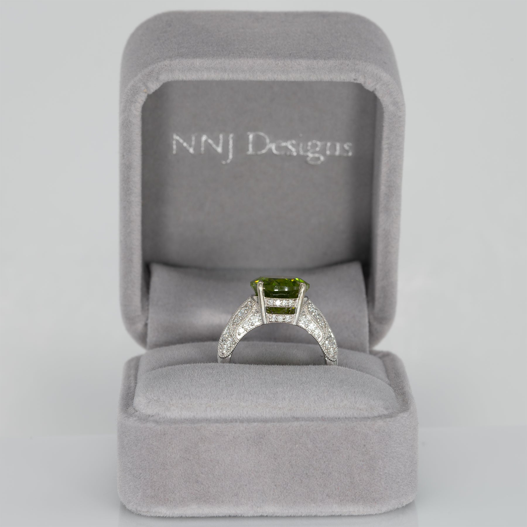 14K white gold peridot oval ring with diamond halo