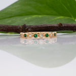 14K yellow gold Zambian emerald band ring with diamond accents