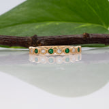 14K yellow gold Zambian emerald band ring with diamond accents