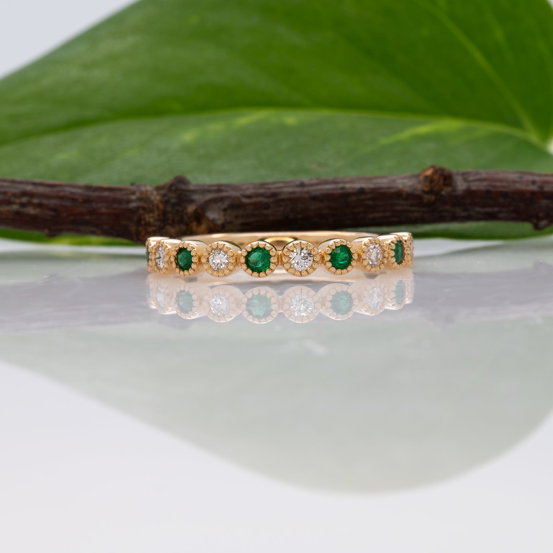 14K yellow gold Zambian emerald band ring with diamond accents