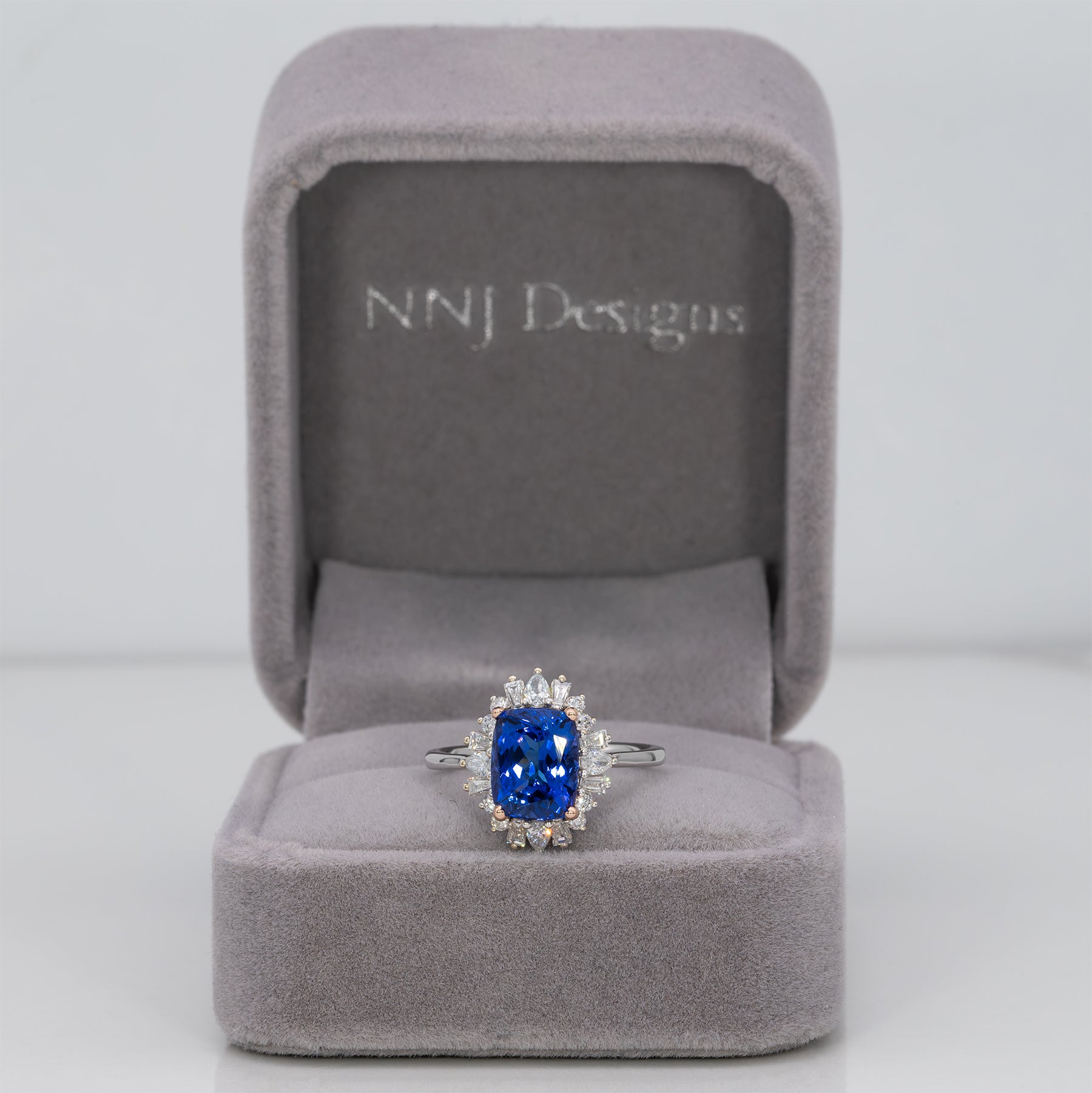 14K white and rose gold tanzanite ring with diamond accents