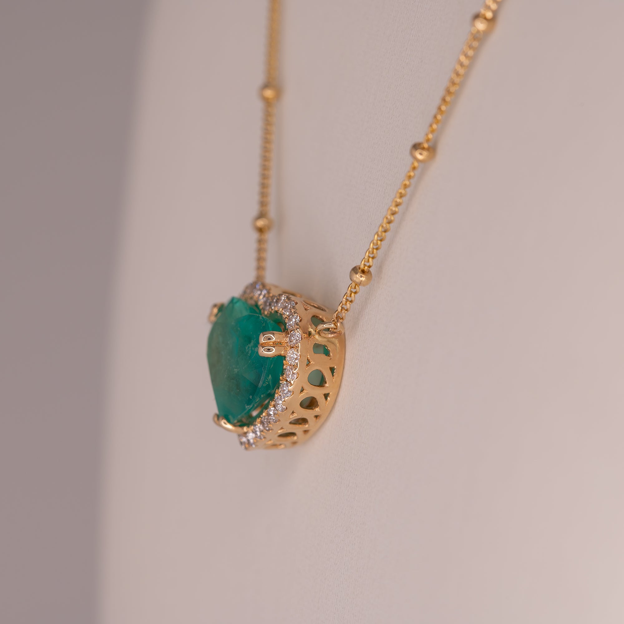 14K yellow gold colombian emerald pendant with diamond accents