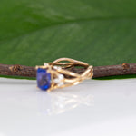 14K yellow gold cushion tanzanite ring with diamond accents