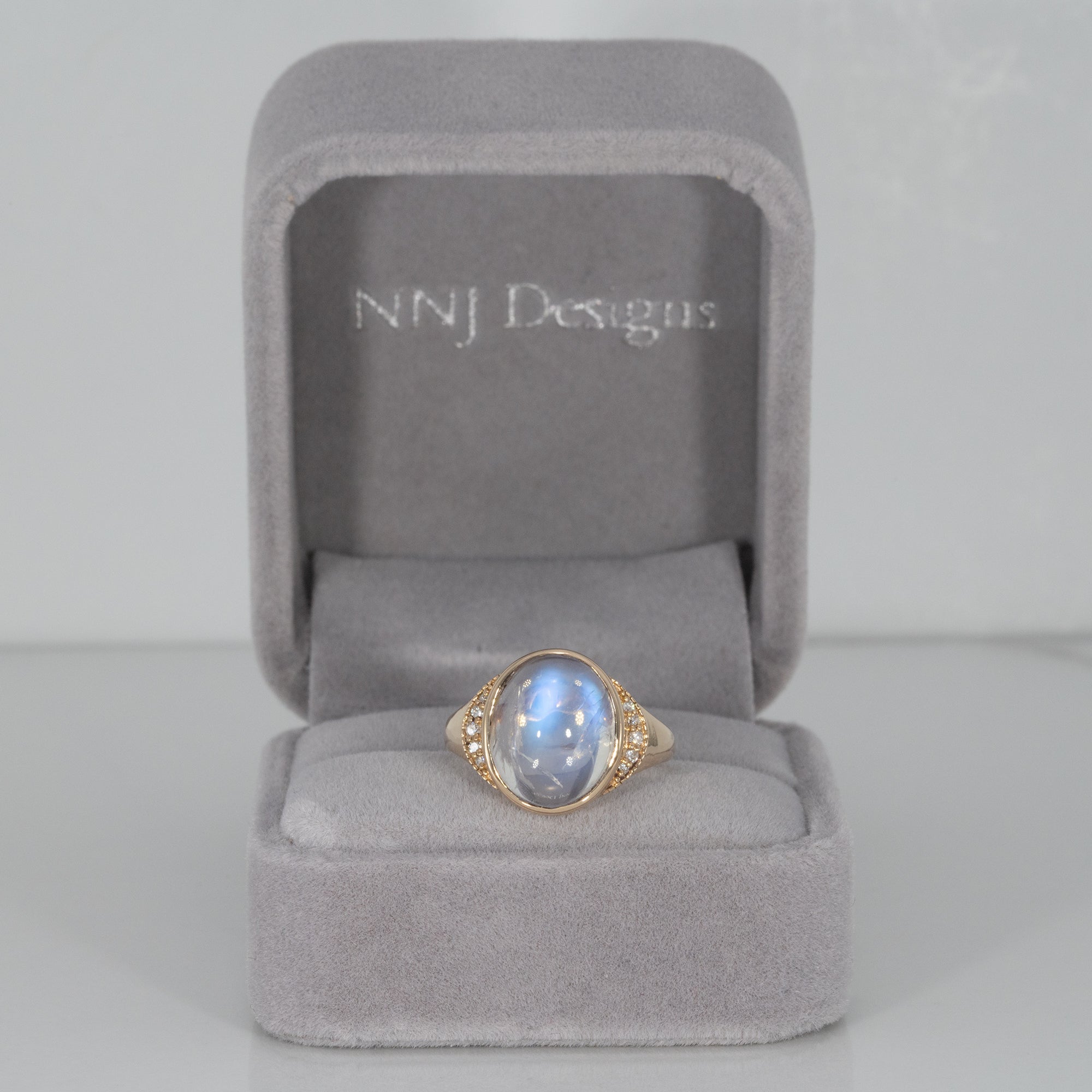 14K yellow gold rainbow moonstone cabochon ring with diamonds