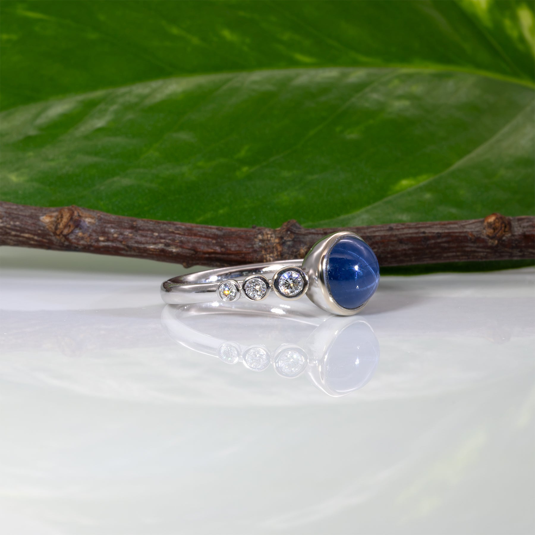 14K white gold blue star sapphire cabochon ring with diamonds