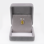 Sphene oval pendant with diamond accents in 14k yellow gold