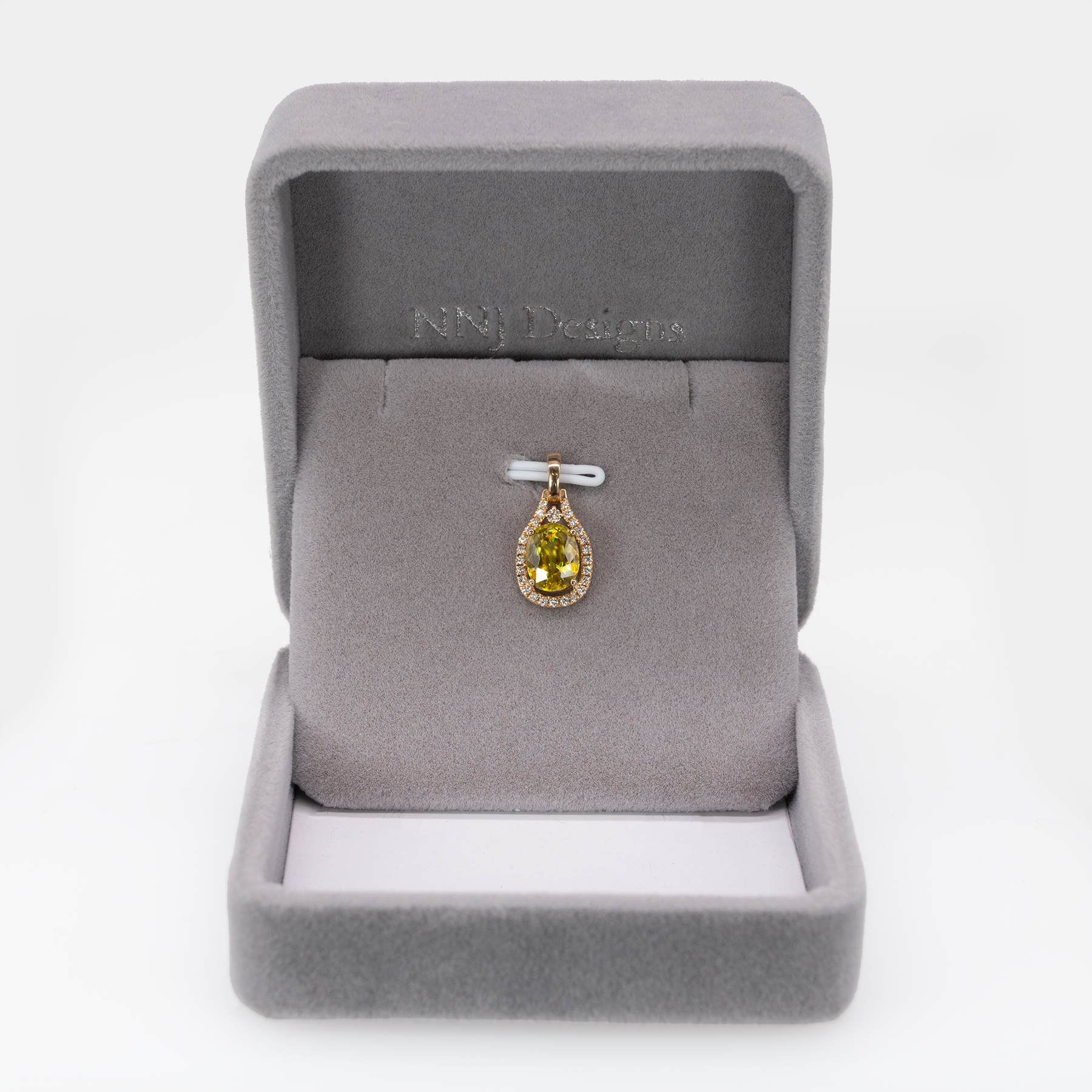 Sphene oval pendant with diamond accents in 14k yellow gold