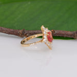 14K yellow gold padparadscha sapphire ring with diamond accents