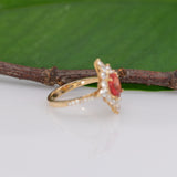 14K yellow gold padparadscha sapphire ring with diamond accents