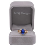 14K yellow gold cushion tanzanite ring with diamond accents