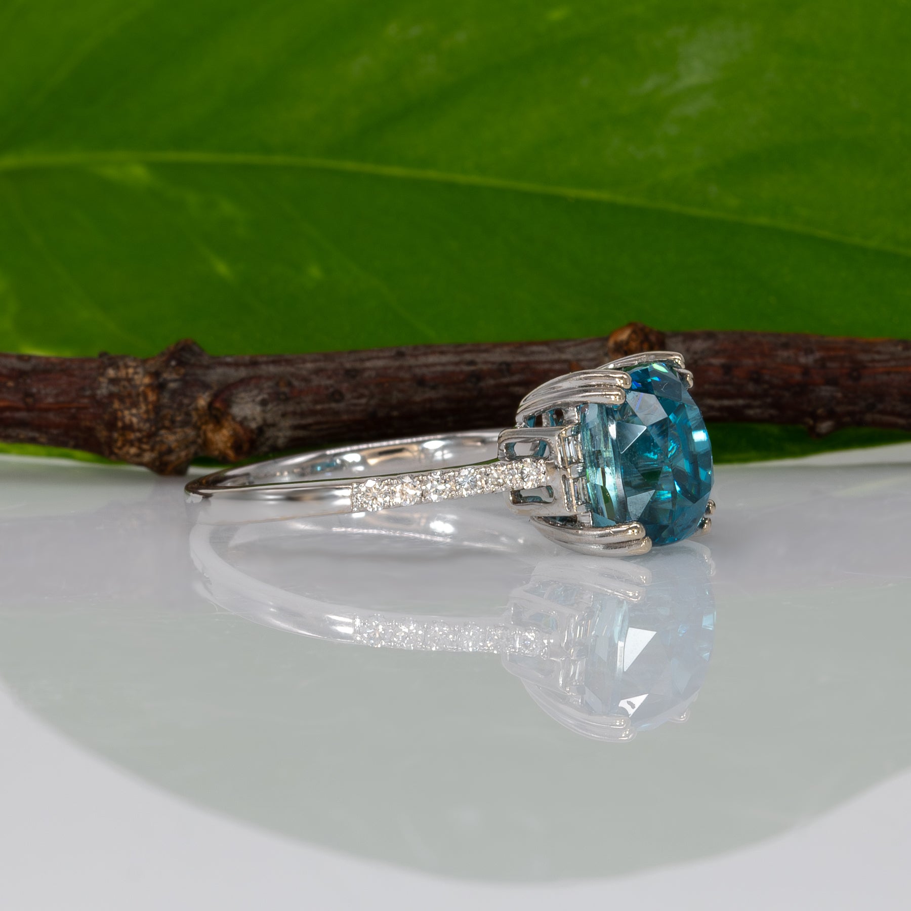 14K white gold Cambodian blue zircon cushion ring with diamond accents