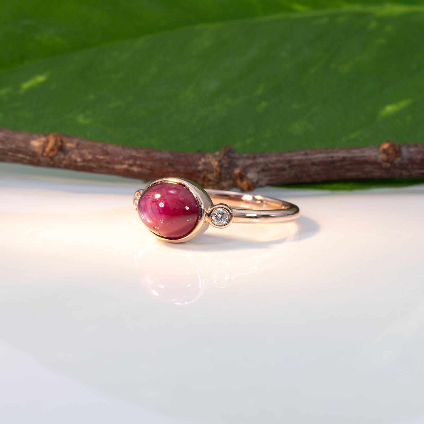 14K rose gold star ruby cabochon ring with diamond accents