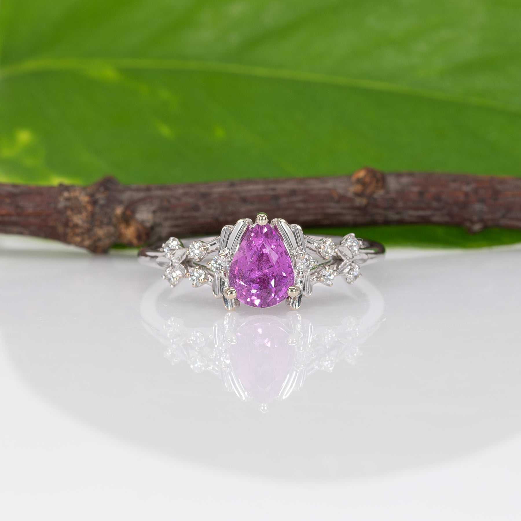 14K white gold pink sapphire pear ring with diamond halo
