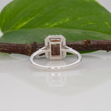 14K white gold bi-color tourmaline emerald-cut ring with diamond halo
