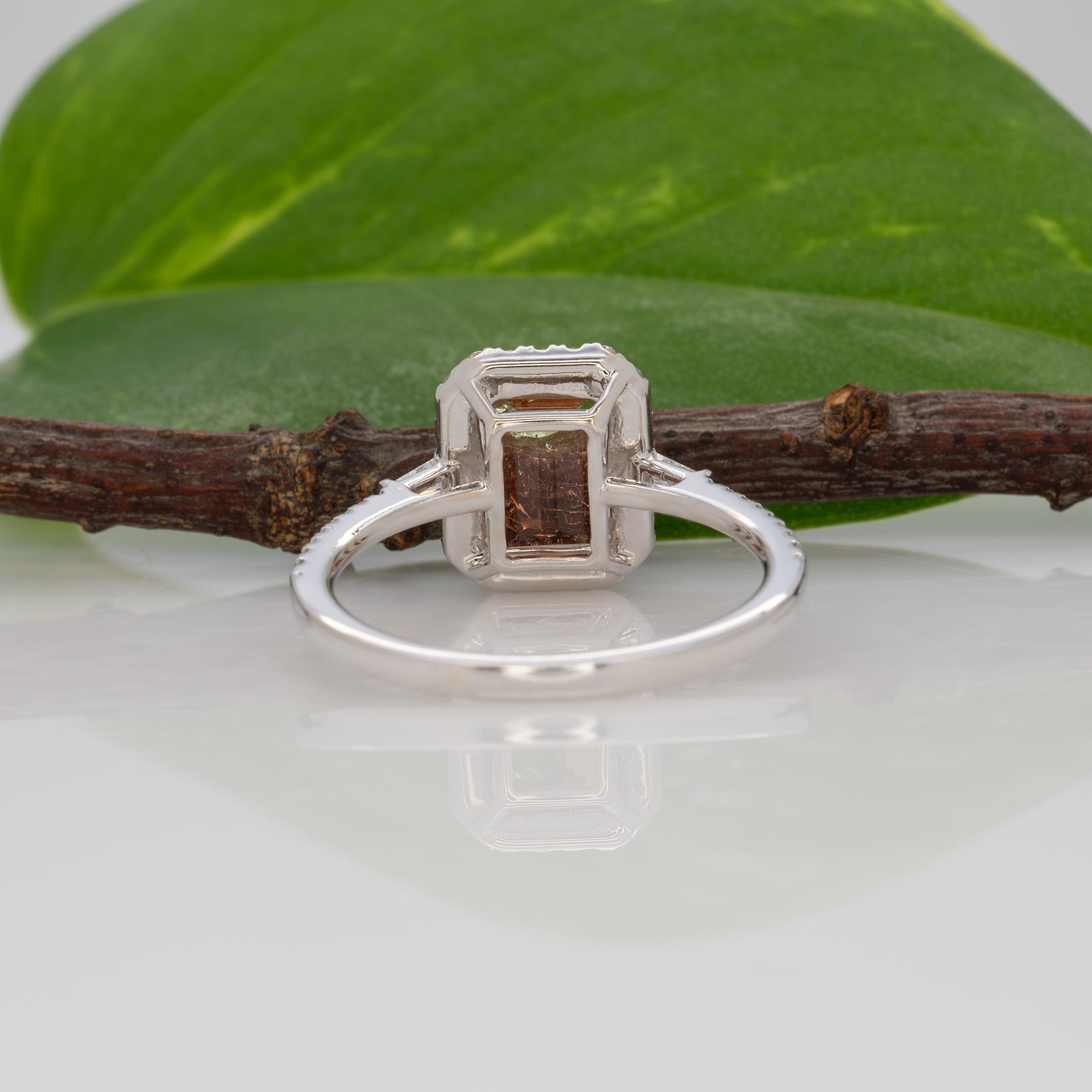 14K white gold bi-color tourmaline emerald-cut ring with diamond halo