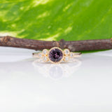 14K yellow gold bezel-set purple spinel ring with diamond accents