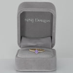 14K yellow gold purple sapphire round ring with diamond halo