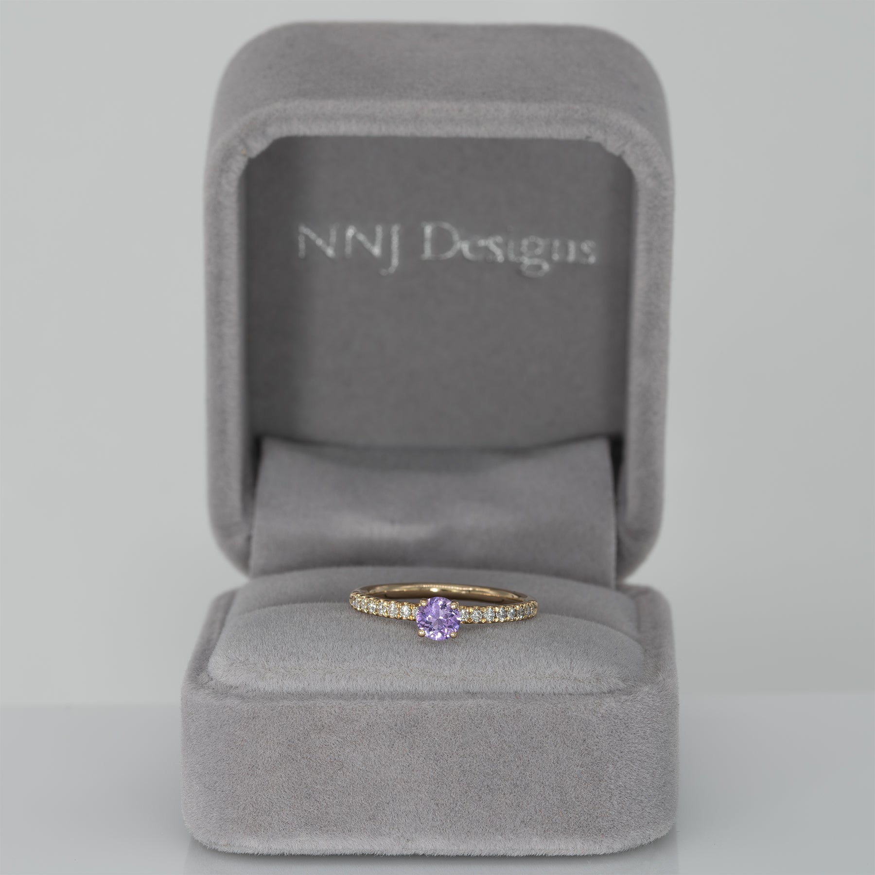14K yellow gold purple sapphire round ring with diamond halo