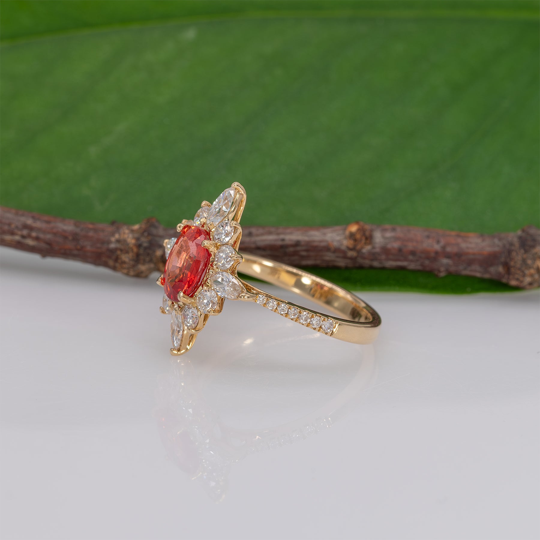 14K yellow gold padparadscha sapphire ring with diamond accents