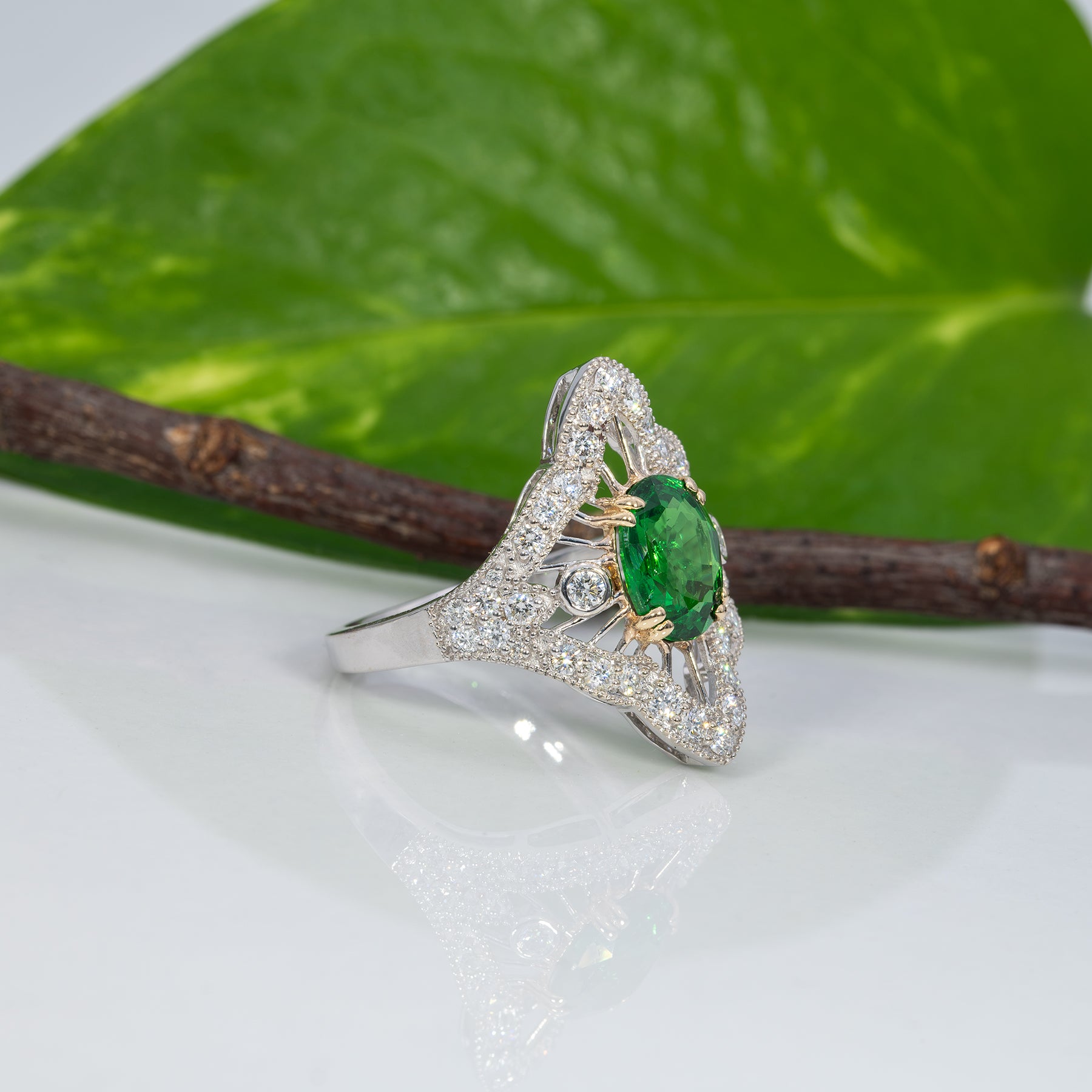 14K two-tone gold tsavorite garnet ring with diamond accents