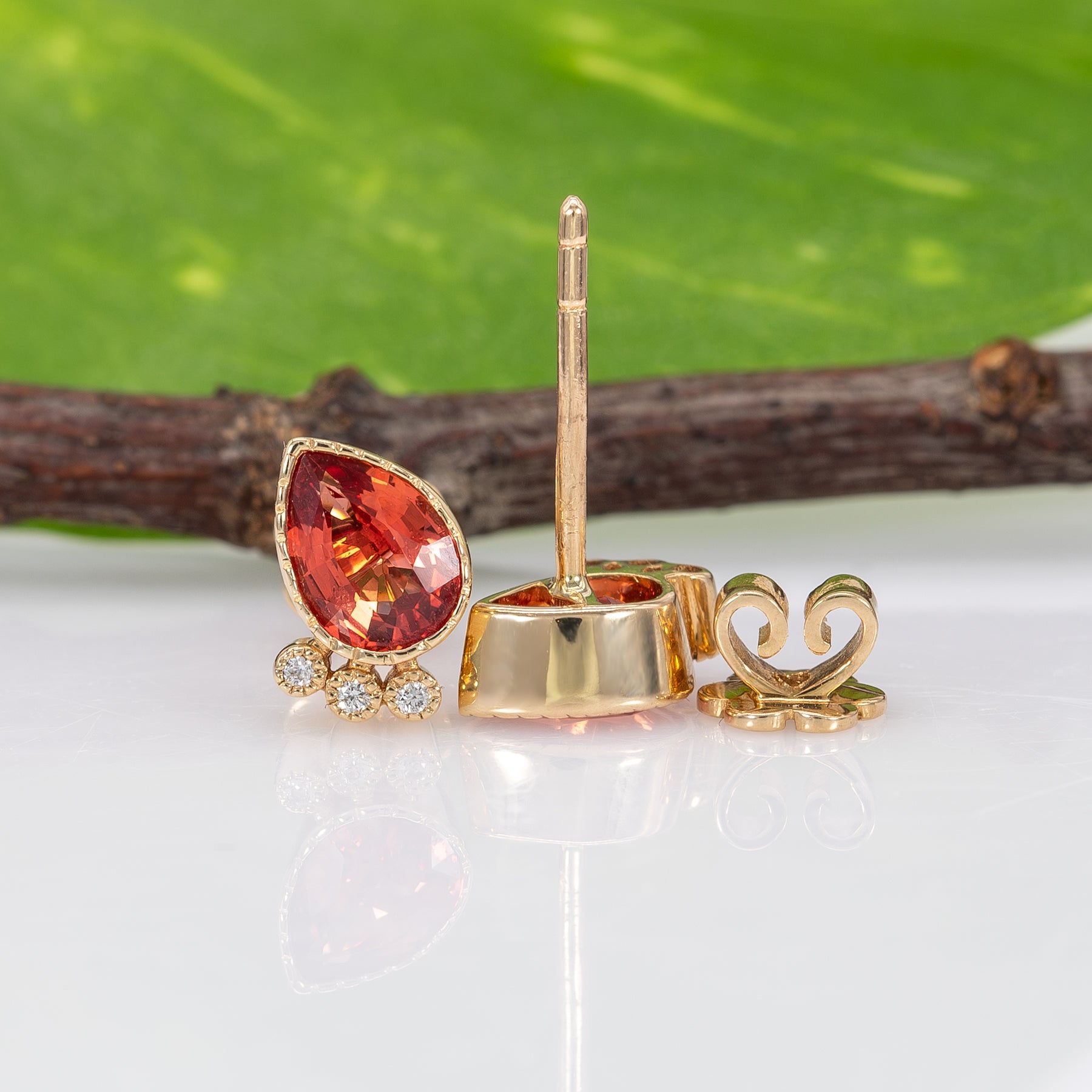 14K white gold padparadscha sapphire pear earrings with diamond accents