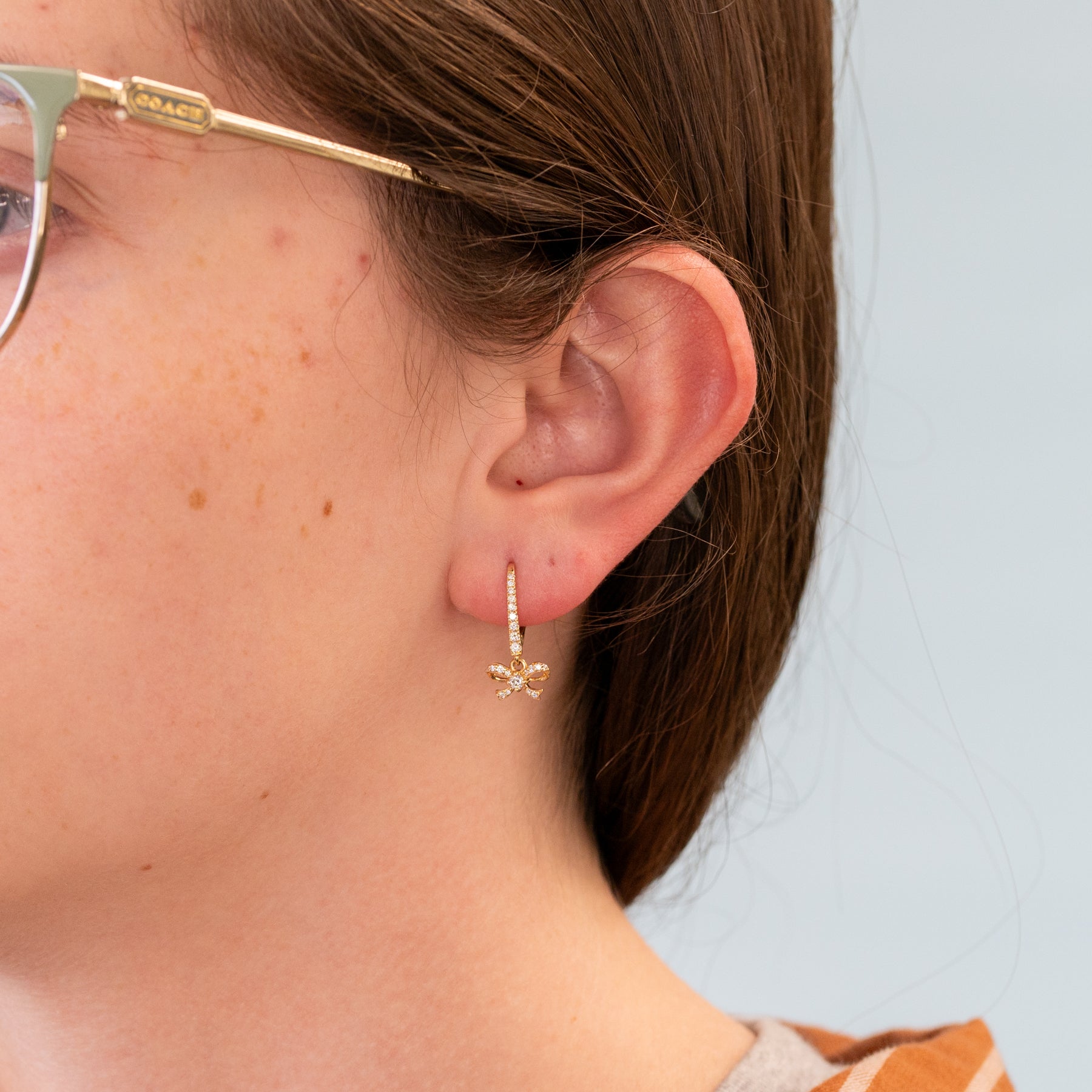 14K yellow gold diamond bow leverback earrings