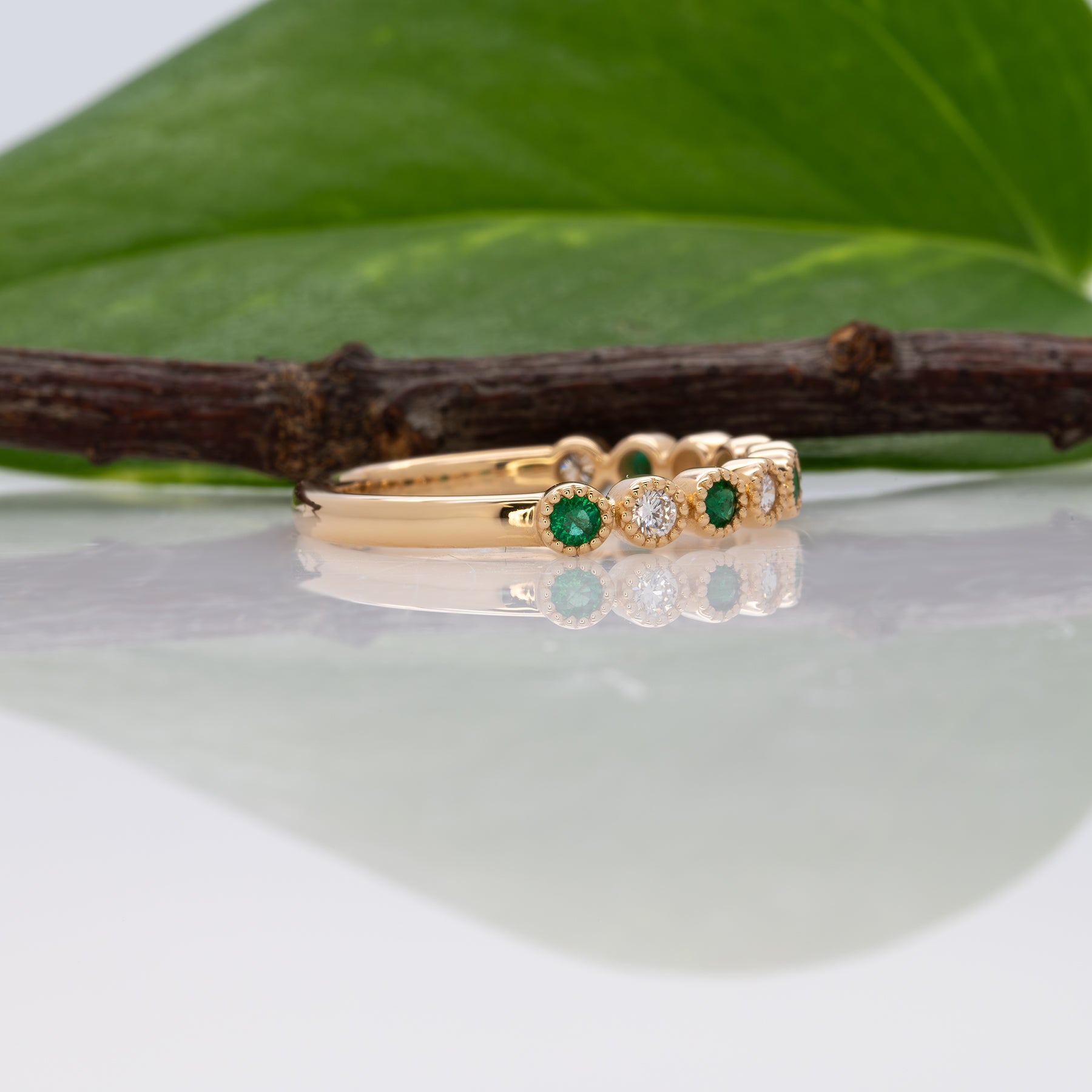 14K yellow gold Zambian emerald band ring with diamond accents