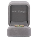 14K yellow gold band with round Zambian emerald accents
