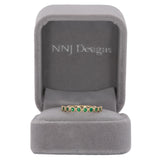 14K yellow gold band with round Zambian emerald accents