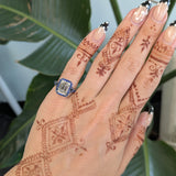 platinum lab grown diamond ring with blue sapphire accents