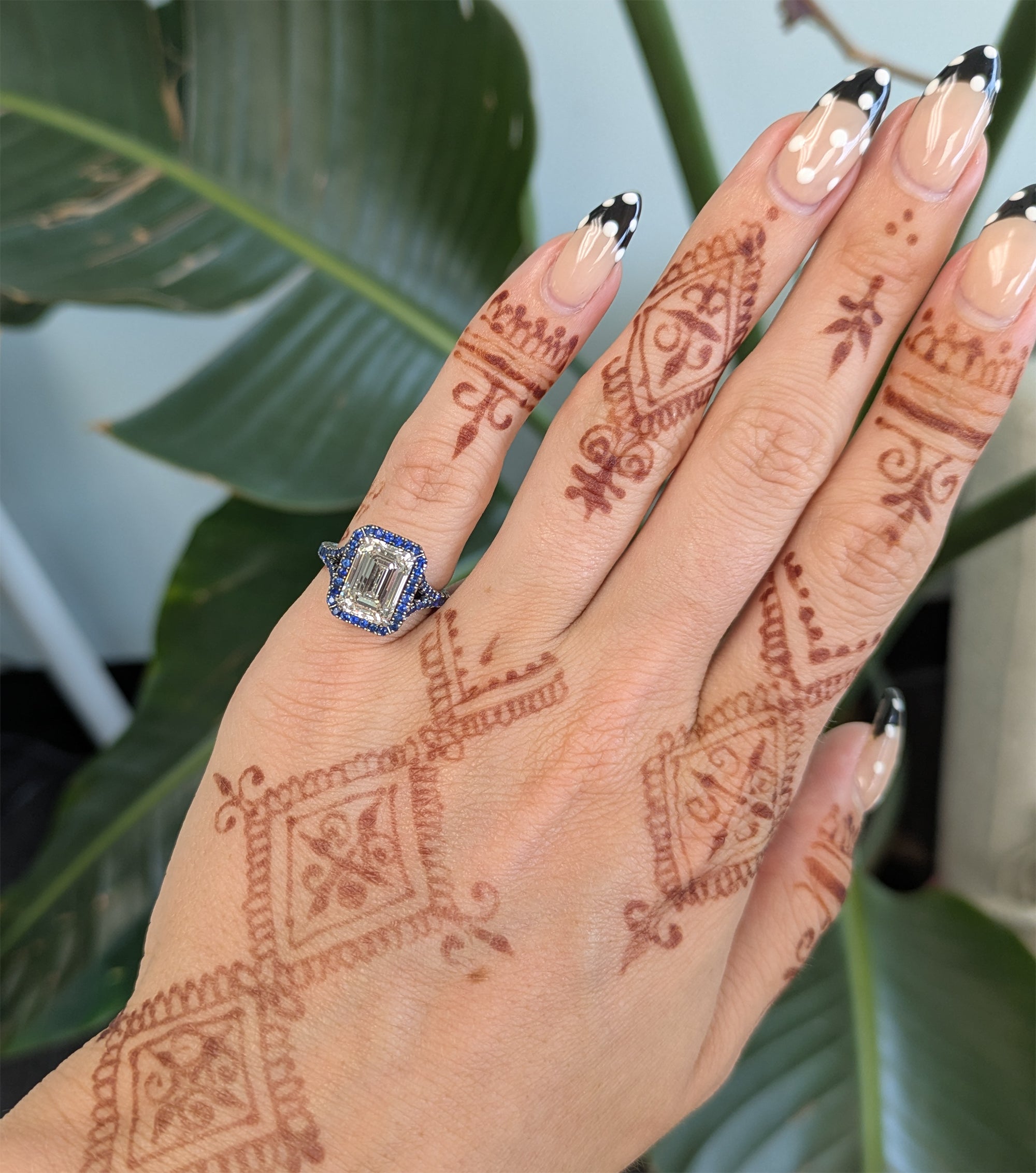 platinum lab grown diamond ring with blue sapphire accents
