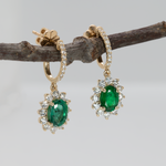 Emerald Stud Earrings in 14K Yellow Gold | Diamond Accents | Oval Cut | 7x5mm | May Birthstone