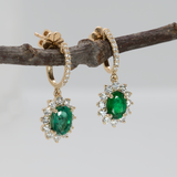 Emerald Stud Earrings in 14K Yellow Gold | Diamond Accents | Oval Cut | 7x5mm | May Birthstone