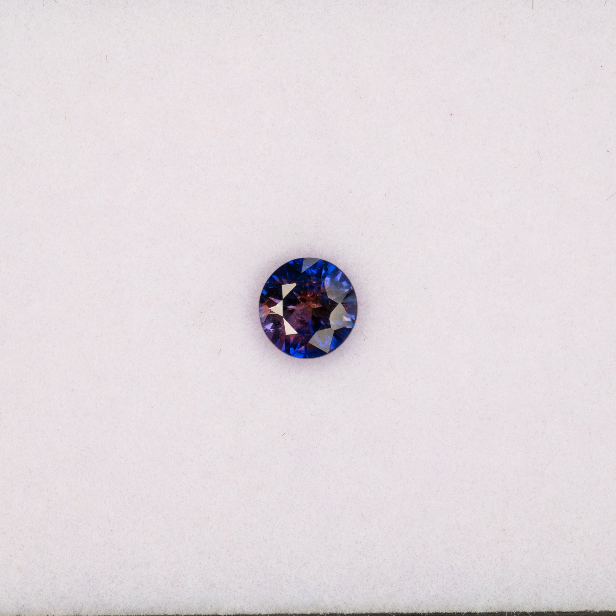 0.68 carat natural bi-color sapphire, round 5.2mm loose gemstone