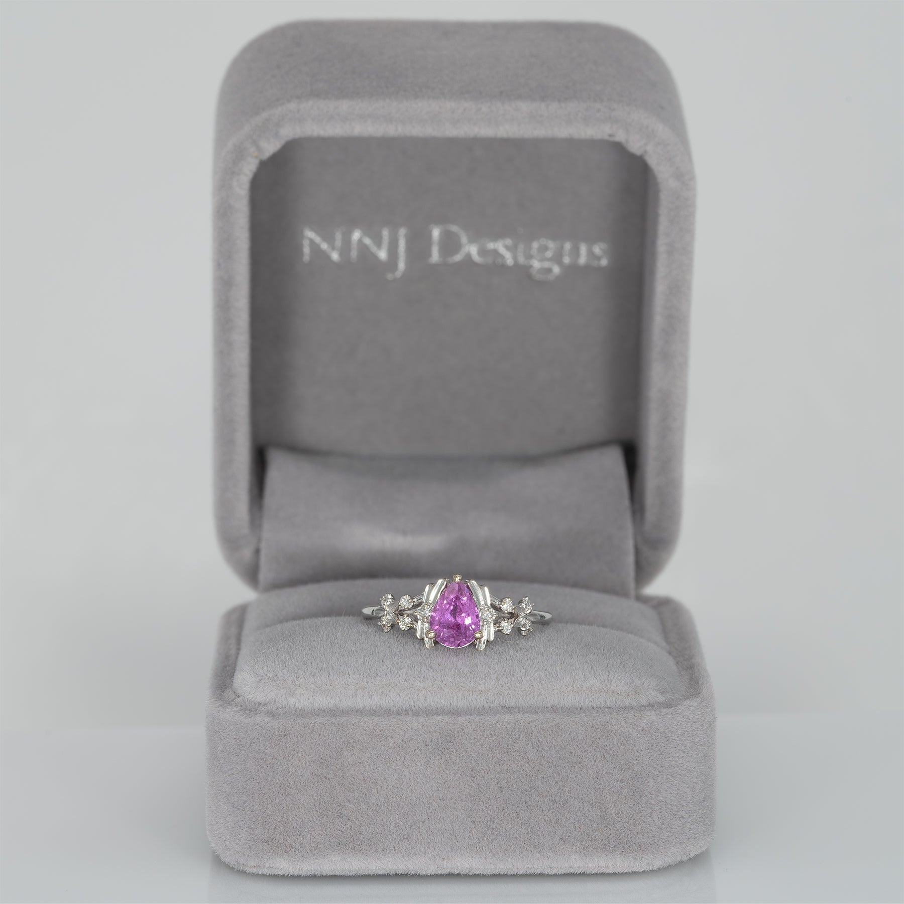 14K white gold pink sapphire pear ring with diamond halo
