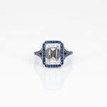 platinum lab grown diamond ring with blue sapphire accents