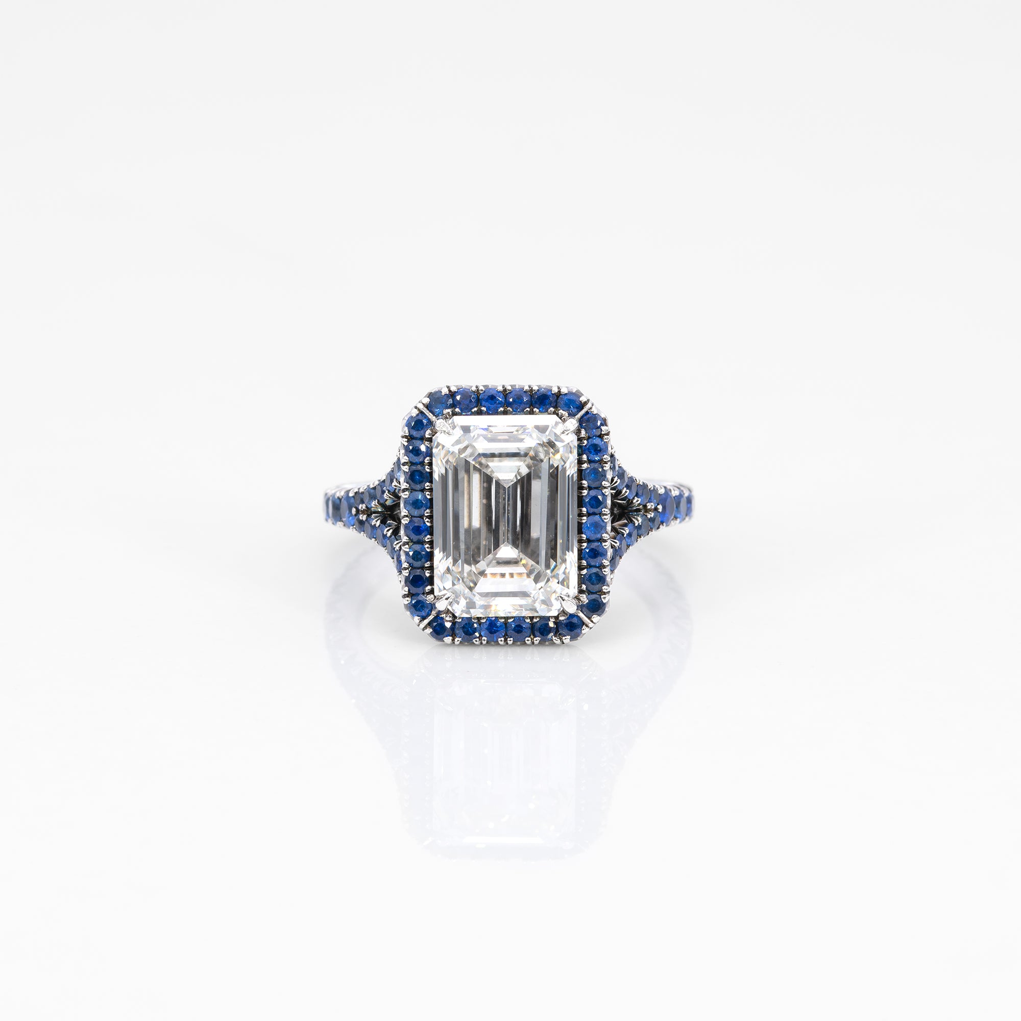 platinum lab grown diamond ring with blue sapphire accents