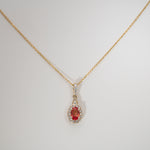 14K yellow gold padparadscha sapphire pendant