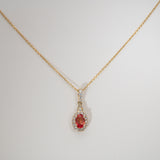 14K yellow gold padparadscha sapphire pendant