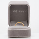 14K yellow gold Zambian emerald band ring with diamond accents