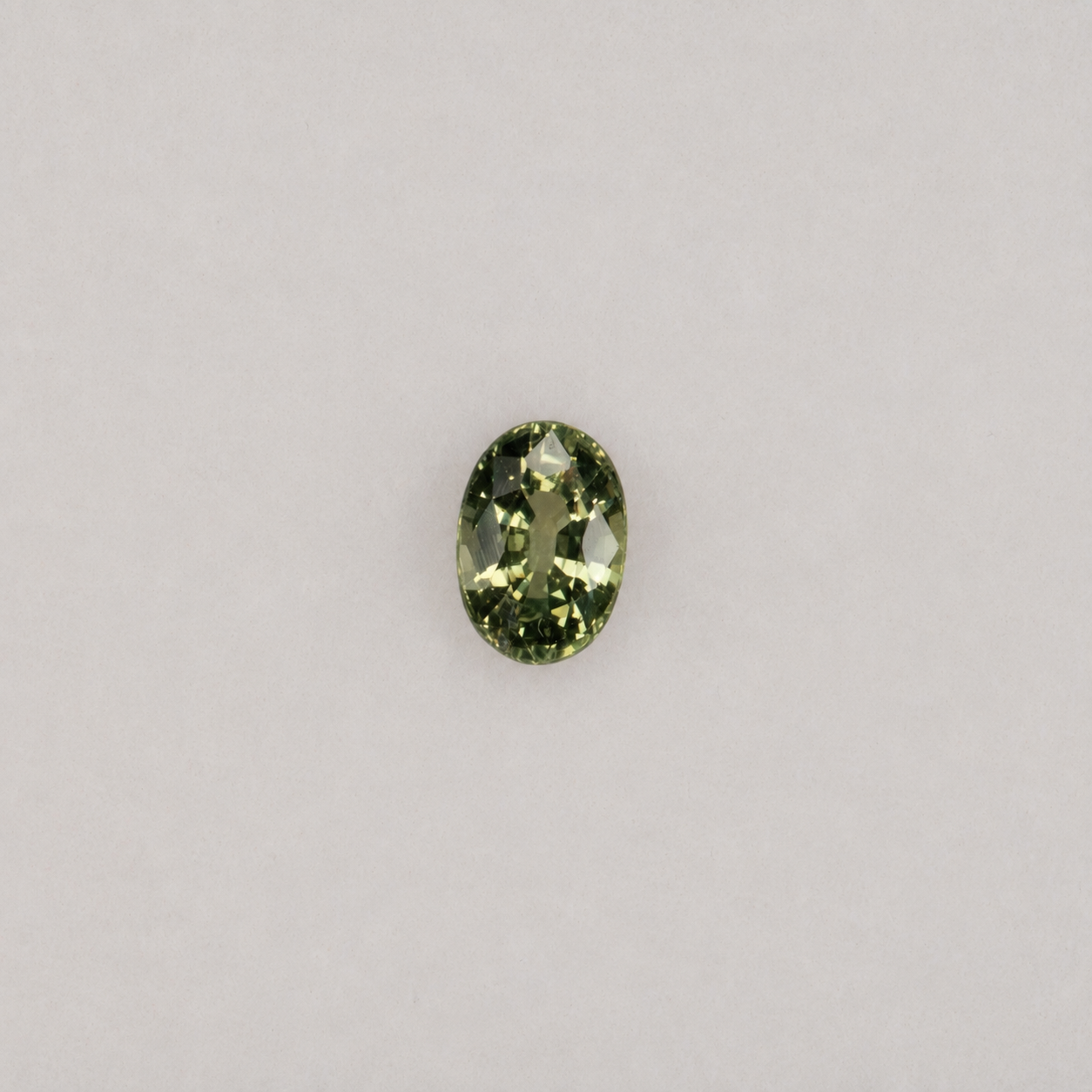 0.38 carat natural green sapphire, oval 6x4mm Ceylon loose gemstone