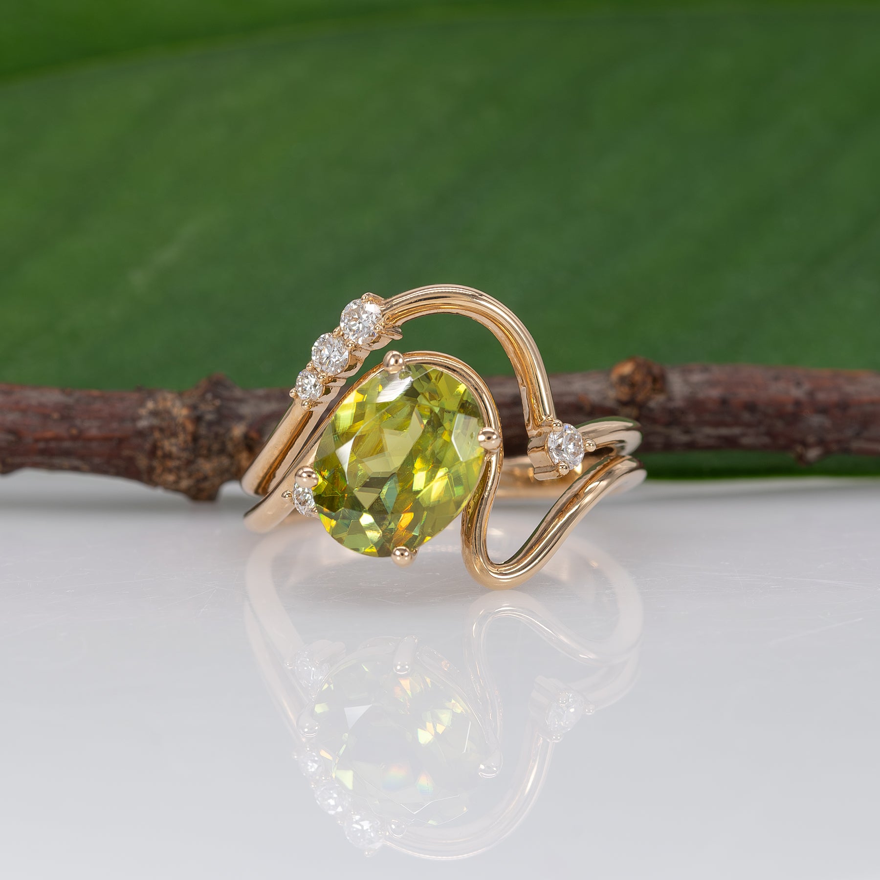 14K yellow gold sphene ring with diamond halo