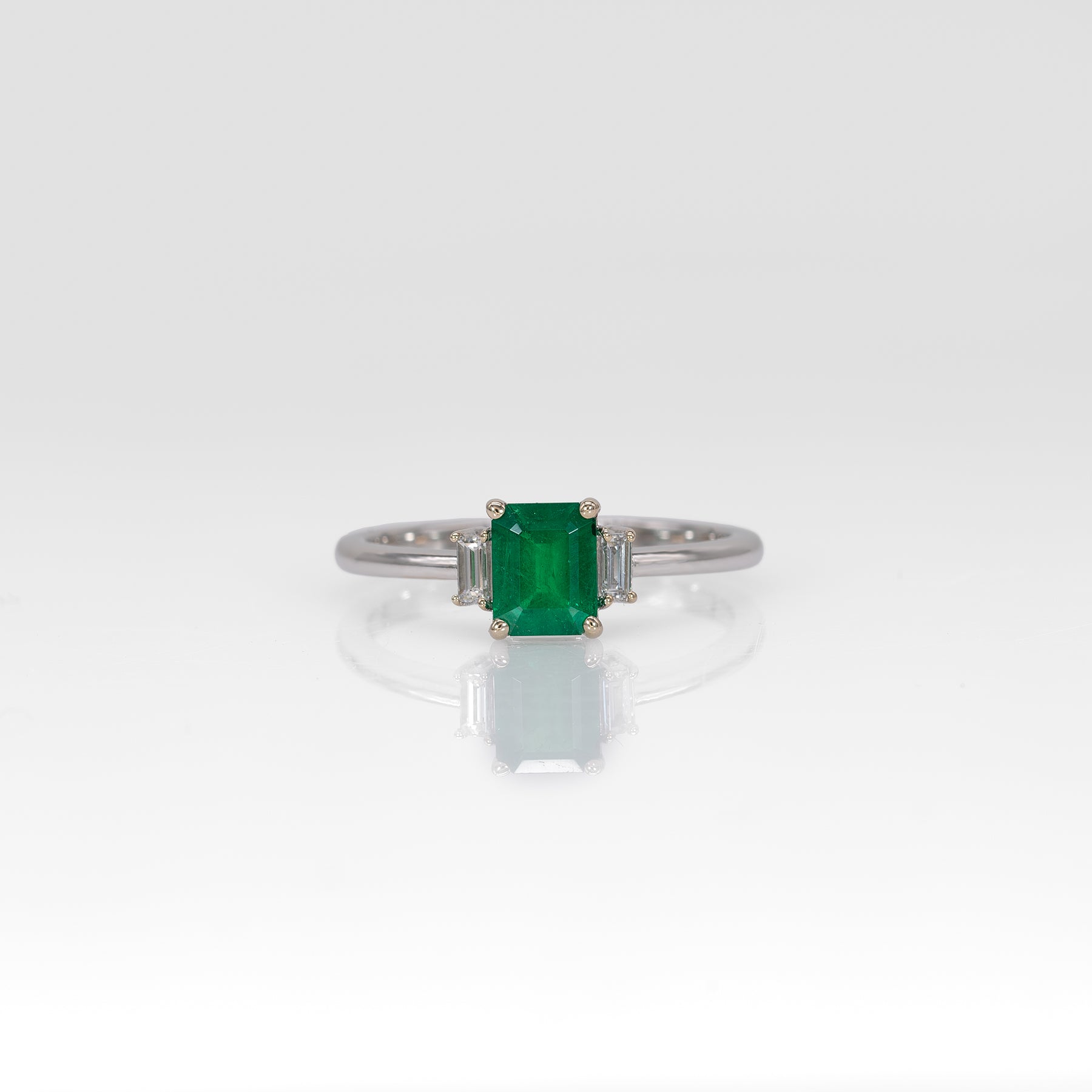 14K white gold Colombian emerald ring with diamond accents