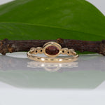 14K yellow gold padparadscha sapphire oval ring with diamond accents