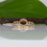 14K yellow gold padparadscha sapphire oval ring with diamond accents