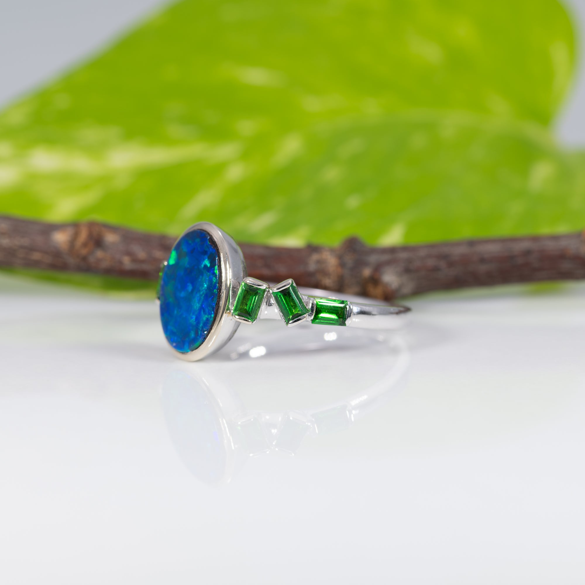 14K white gold boulder opal cabochon ring with tsavorite accents