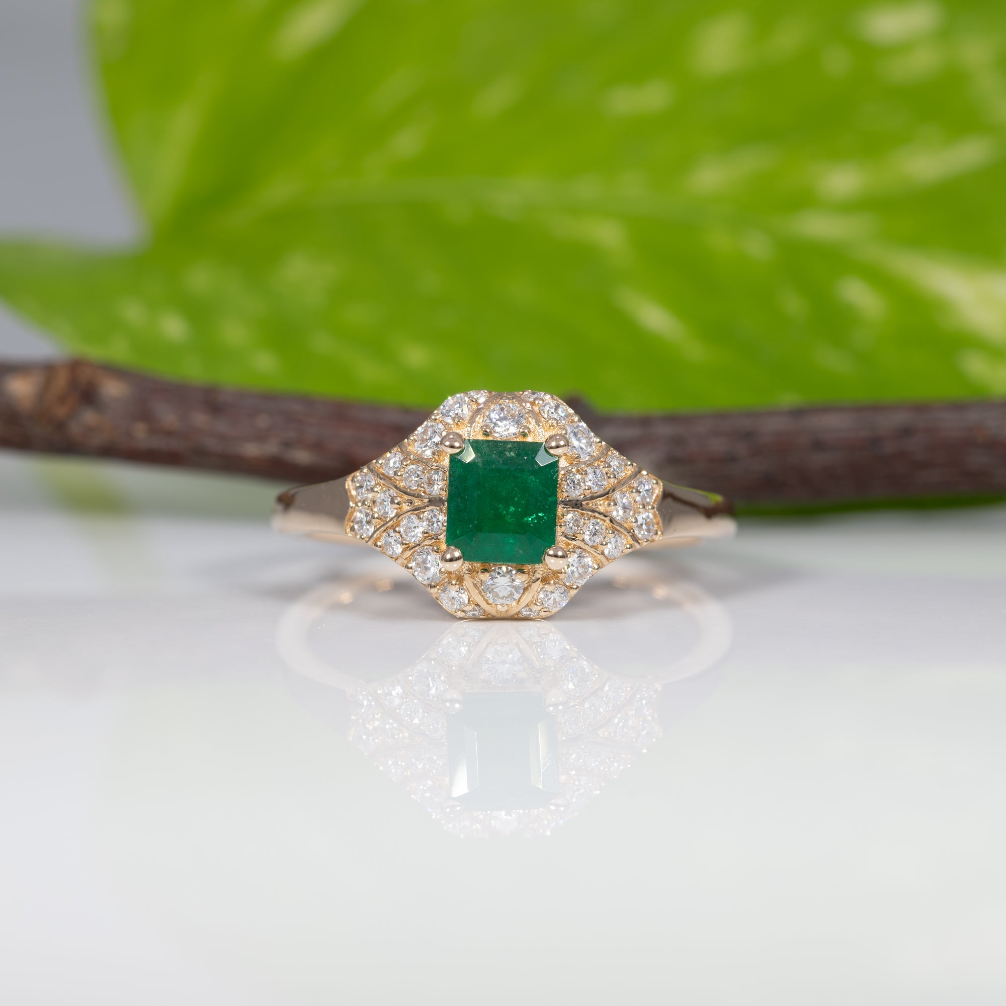 14K yellow gold Colombian emerald ring with diamond accents